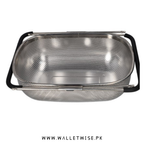 Metallic colander with black handles on a white background, branded 'www.walletwise.pk'.